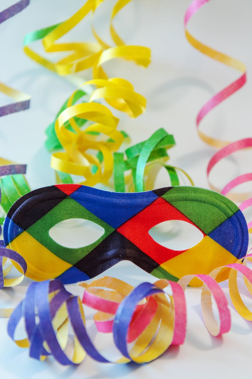 close up of a colorful eye mask and streamers